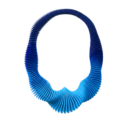Blue Gradient 3D printed flexible necklace on a white background by Phase Jewellery